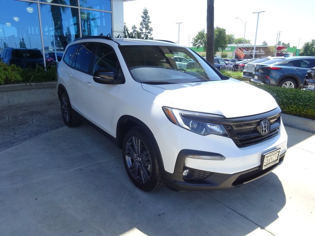 2022 Honda Pilot AWD Sport in White — front three-quarter view